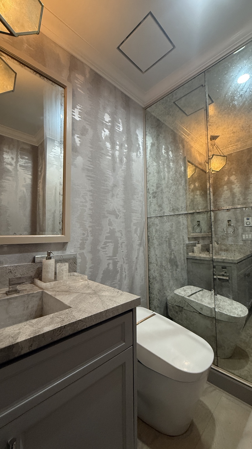 Reflective silver specialty wallcovering installed in a bathroom